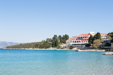 Fototapeta premium Transparent Adriatic sea and hotel accommodation in historic town Korcula in Croatia, summer vacation on Adriatic coast
