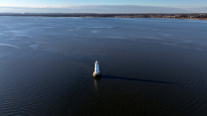 Aerial view of the Great Beds Lighthouse on the Raritan Bay in front of South Amboy, NJ