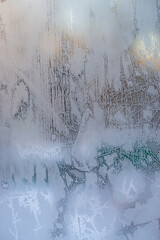 window glass covered with ice and frost.