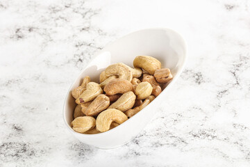 Fototapeta na wymiar Cashew nuts heap in the bowl