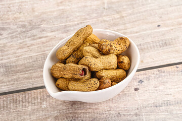 Raw ripe unpeeled peanut heap