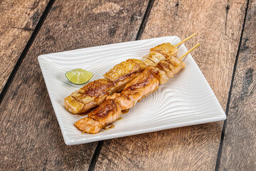 Grilled salmon skewer with sauce