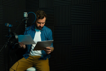Male voice actor recording in studio