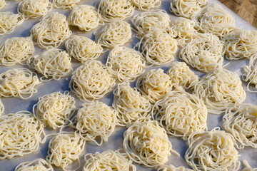 Kurdai or kurawadi, Kurdai or Kurdayi or Kurdayee is a snack akin to papads, Its a type of fryums which is made using wheat (gehu), traditional maharashtrian food.