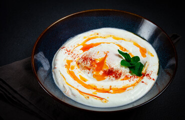 сilbir, traditional Turkish breakfast, Turkish eggs with yogurt and butter, homemade, no people,
