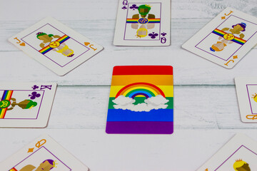 Colorful Cards laid on table with a rainbow flag