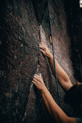 Man climbing a rocky mountain wall
