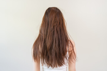 Back view of long hair Young woman have problem with dyed hair and damaged.