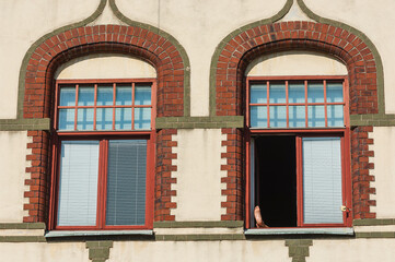 Fototapeta premium A persons foot is sticking out of a window