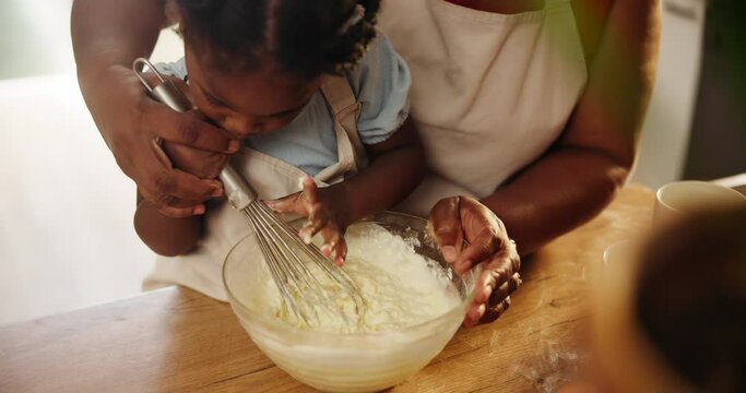Grandmother, kid and mixing for baking in home, education and learning for child development. Black family, kitchen and love for pastry or cake and dessert, whisk and cooking while bonding on weekend