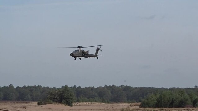 Attack Helicopter Flying low between trees