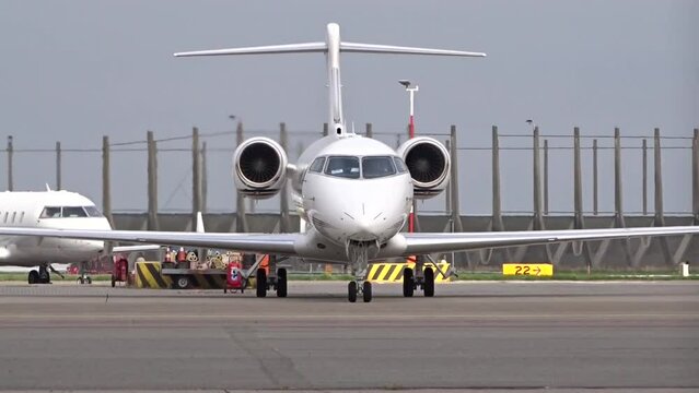 Private Business Corporate Executive Jet with Engines running waiting for departure