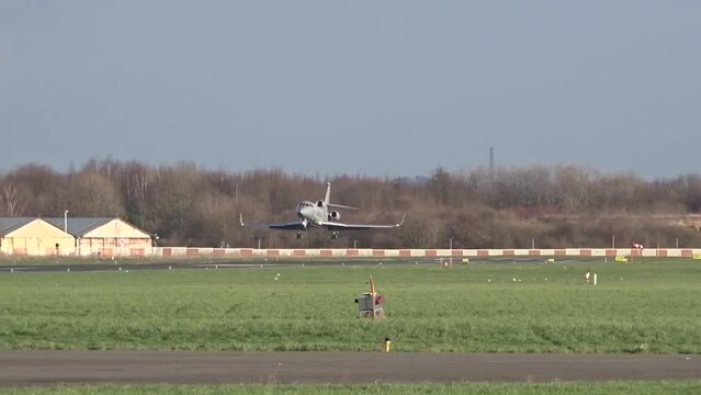 Grey Unmarked Generic Mysterious Private Business Corporate Executive Jet Landing Arriving Arrival Touchdown at a Regional Local Small Airport