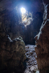old cave with light shining through