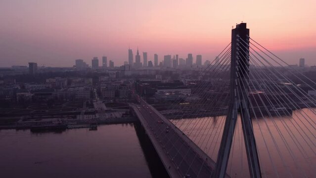 Bridge and city skyline at dusk, aerial