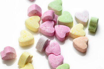 Fototapeta na wymiar Pink and purple heart shaped candies. Valentine's day background. 3