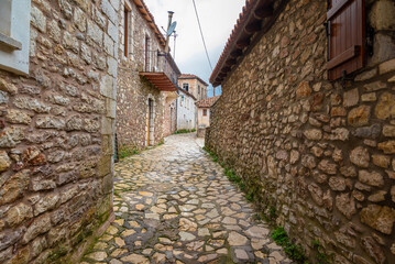 Street view of Dimitsana village in Arcadia, Peloponnese, Greece. Narrow cobblestone alleys.