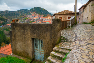 Fototapeta na wymiar Street view of Dimitsana village in Arcadia, Peloponnese, Greece. Narrow cobblestone alleys.