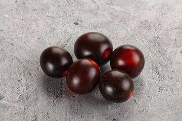 Raw ripe black kumato tomato