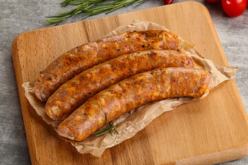 Raw sausages with spices and herbs
