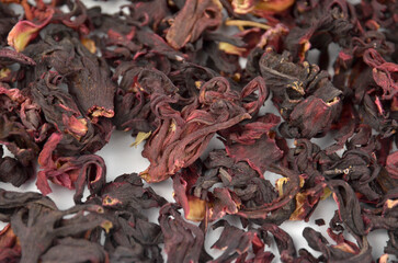 Egyptian hibiscus dry red tea (karkade) background, closeup (macro), top view