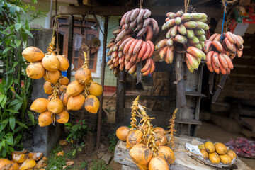 Colorful Fruit Display at a Stand in Sri Lanka. A fruit stand in Sri Lanka with several bunches of...