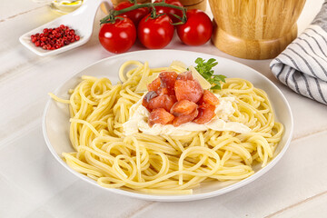 Pasta spaghetti with salmon and stracciatella