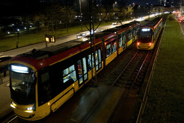 Night Transit, Trams at a City Stop, One Stationary and the Other in Motion, night transport in the...