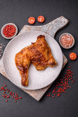 Delicious grilled chicken leg or quarter with salt and spices