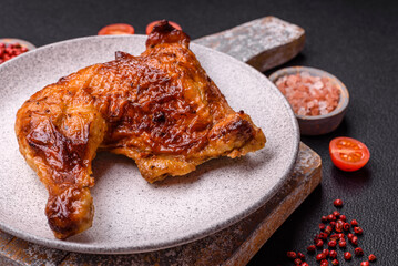 Delicious grilled chicken leg or quarter with salt and spices