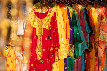 Variety of traditional Emirati style dresses displayed in the market in Abu Dhabi