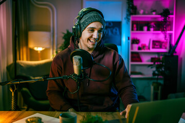 man shooting or streaming video podcast or vlogg blogger at studio