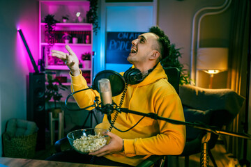 man shooting or streaming video podcast or vlogg blogger at studio