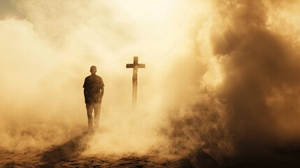 Silhouette of a man in the desert with a cross in the smoke and dust under the sun. 
