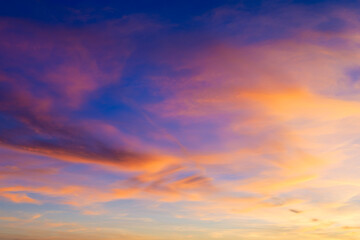 Pink clouds during sunset. Blue sky. Sunshine. A huge clouds in the sky after a storm. Natural...