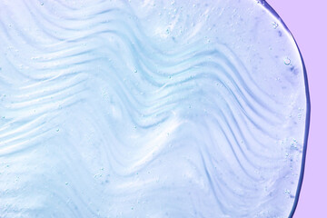 Liquid gel or serum on a screen of microscope blue green  reflected background glitter