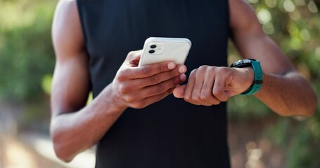 Black man, fitness and smartphone with watch in nature for exercise, workout and tracking time. Athlete, training and technology outdoors for sports, schedule and check for progress in forest