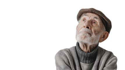 An elderly man in a cozy sweater gazes upwards thoughtfully while wearing a stylish hat