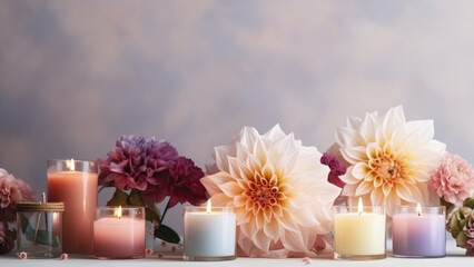 Obraz na płótnie Canvas An incredible atmosphere,dahlias and aromatic candles on a gentle background of pastel colors 