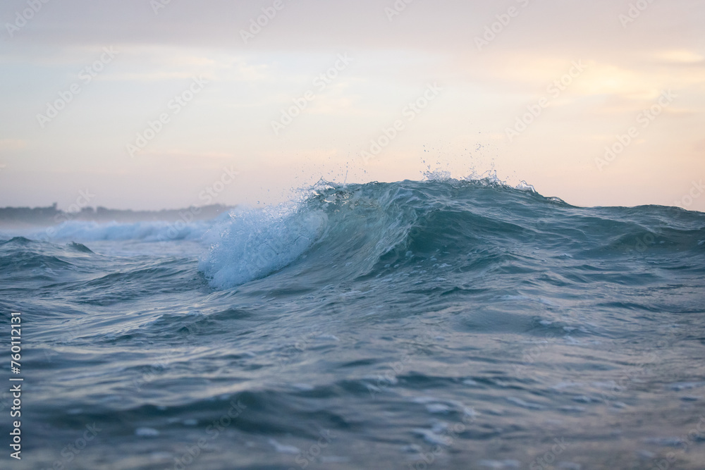 Canvas Prints a small wave in the ocean.