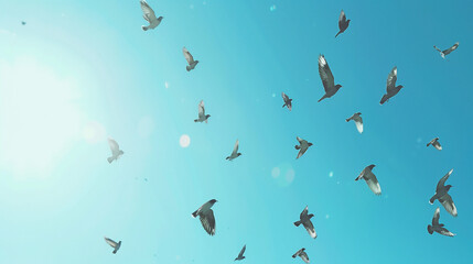 Migrating birds soaring across a clear blue sky