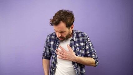 Man having an asthma attack and looking for his inhaler to help him breathe better