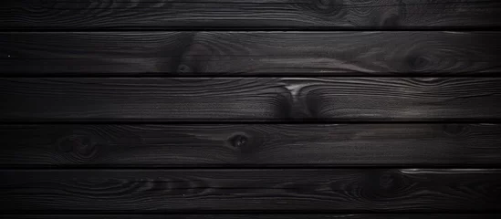 Fotobehang A detailed shot of a dark grey hardwood wall, resembling an automotive tire tread pattern with parallel rectangles and shades of black © AkuAku