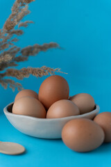 Eggs in a basket. Easter eggs. Country chicken eggs. 