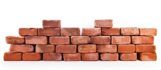 A brown brick wall is being constructed with rectangular bricks on a white background. The brickwork is a building material commonly used for walls, flooring, and roofs made of wood