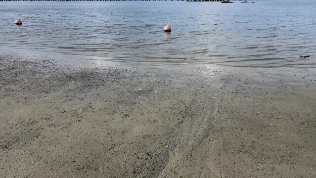 Beach in Jakarta, Indonesia, the water is not blue