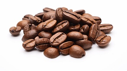 Freshly roasted coffee beans are strewn about on a clean white surface, showcasing the beans' glossy texture and rich color