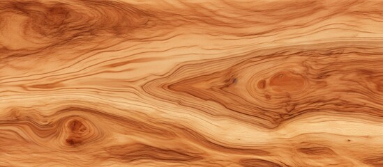 A closeup of a piece of hardwood with a swirling pattern in shades of brown, amber, and peach. The wood stain enhances the natural formation of the flooring ingredient