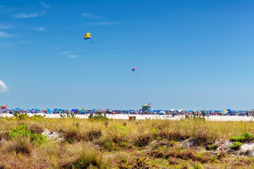 Beautiful Sunny day in Siesta Key Beach, Sarasota, Florida. Bright blue sky and sea during spring break tourist season.