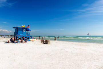 Lifeguard hut on Siesta Key Beach in a beautiful summer day with ocean and blue sky.